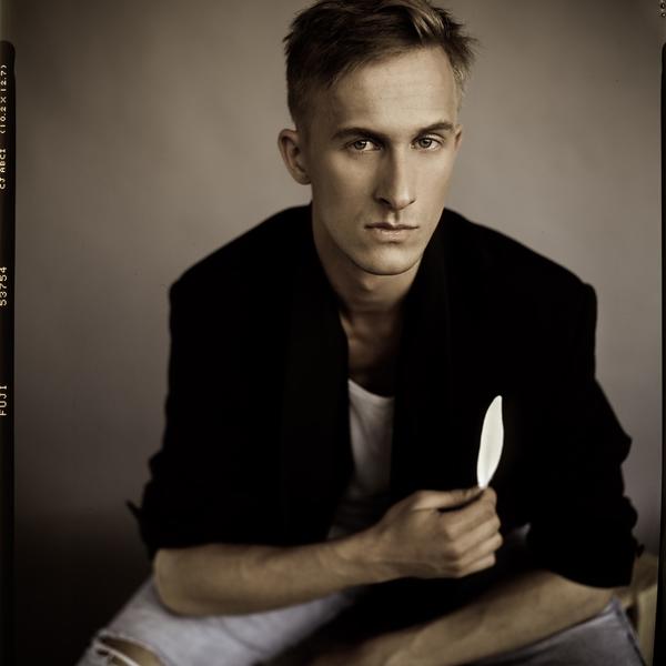 Man with Feather by Piotr Biegaj