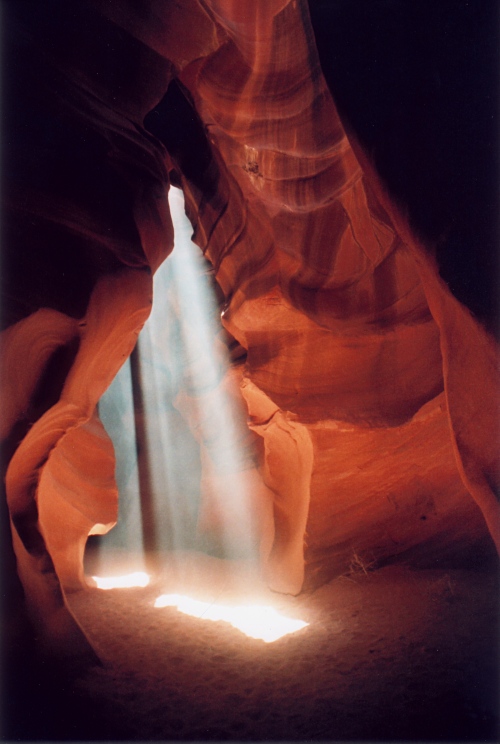 Let There Be Light, photography by Pat Goltz. Picture taken in Antelope Canyon, a famous slot canyon in northern Arizona. This kind of rays is somewhat rare. You have to go at the right time of year and day, and there must be dust in the air. On this day, it was windy, and there was a lot of sand and dust. This reminds me that without the light God created, there would be no photography.. Pentax SLR, 55mm Pentax lens. photography. In Nature, Scenery
