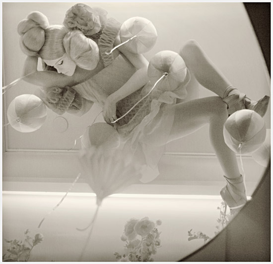 Sleeping on the ceiling, photography by Olivier Daaram Jollant. Sleeping on the ceiling // Dormir au plafond
In a shop window at: Les Galeries Lafayette in Paris, a dummy settle on the ceiling viewed in a mirror on the floor. 

Photo: 23/12/2008. In People, Portrait