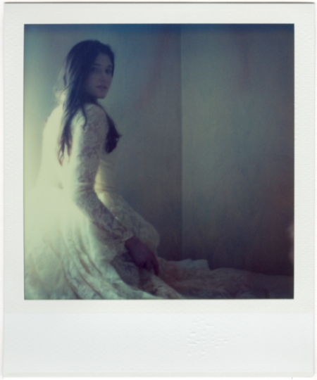 Becoming Light, photography by Elinor Scott-sutter. The light becomes her, and she becomes light.. Polaroid ProntB. Time-Zero film, low light. In People, Miscellaneous, Female