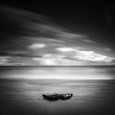 Boat on the beach, photography by Serdar Akin. Canon 5D. long exposure. In Nature, Scenery, Waterscape