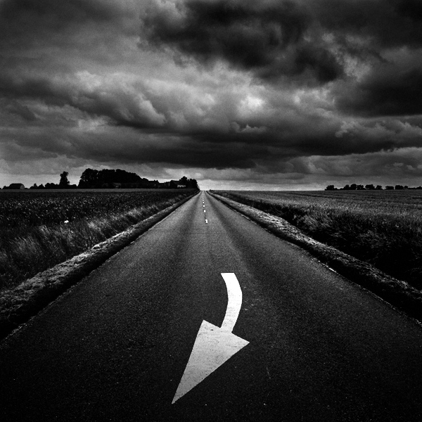 Bad signs ?, photography by Patrick Dagonnot. (Le Perche - Juin 2007) Devant moi, des gros nuages noirs s'amoncelaient. Le pire &eacute;tait peut-&ecirc;tre &agrave; venir, au bout de cette route qui ne semblait aller nulle part. Tous les signes se liaient pour me dire de faire demi-tour. Malgr&eacute; tout, je continuais &agrave; avancer d'un pas d&eacute;cid&eacute;.... Nikon D80. In Transportation, Road, car, cycle
