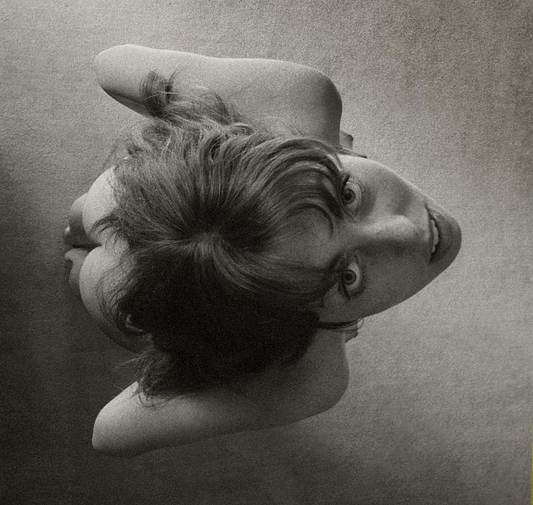 Symmetry / asymmetry 2, photography by Jonathan Charles. I recently found this old neg that I hadn't printed before as it was badly scratched - now cleaned up thanks to the magic of PS.

It is a second photo exploring the effect of asymmetrical lighting on a symmetrical pose producing reversed shadows & highlights. It is from my very early work - please see the "Early nudes" series which has some background info and where you can also find the more abstract version.. Canon P rangefinder, Canon 28mm F2.8 lens. In People, Nude