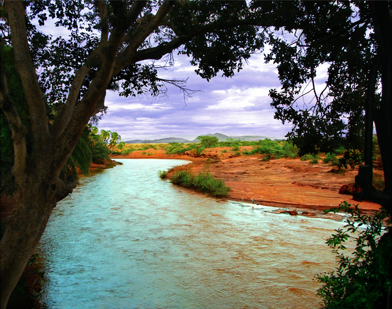 River Don't Cry, photography by Hubert Lebizay. We Are Made One with What We Touch and See

By Oscar Wilde

We are resolved into the supreme air,
We are made one with what we touch and see,
With our heart's blood each crimson sun is fair,
With our young lives each springimpassioned tree
Flames into green, the wildest beasts that range
The moor our kinsmen are, all life is one, and all is change.

With beat of systole and of diastole
One grand great life throbs through earth's giant heart,
And mighty waves of single Being roll
From nerveless germ to man, for we are part
Of every rock and bird and beast and hill,
One with the things that prey on us, and one with what we kill

One sacrament are consecrate, the earth
Not we alone hath passions hymeneal,
The yellow buttercups that shake for mirth
At daybreak know a pleasure not less real
Than we do, when in some freshblossoming wood
We draw the spring into our hearts, and feel that life is good

Is the light vanished from our golden sun,
Or is this daedalfashioned earth less fair,
That we are nature's heritors, and one
With every pulse of life that beats the air?
Rather new suns across the sky shall pass,
New splendour come unto the flower, new glory to the grass.

And we two lovers shall not sit afar,
Critics of nature, but the joyous sea
Shall be our raiment, and the bearded star
Shoot arrows at our pleasure! We shall be
Part of the mighty universal whole,
And through all Aeons mix and mingle with the Kosmic Soul!.

We shall be notes in that great Symphony
Whose cadence circles through the rhythmic spheres,
And all the live World's throbbing heart shall be
One with our heart, the stealthy creeping years
Have lost their terrors now, we shall not die,
The Universe itself shall be our Immortality!

-------------------

Poem's source : http://judithpordon.tripod.com/poetry/

PS : I took the picture in Kenya. Nikon D70. In Nature, Scenery, Waterscape