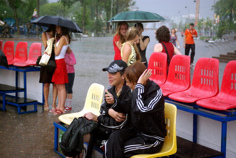 Rendezvous, photography by Bochkarev Mikhail. I made a photo in Tyumen City, Russia. A lot of people came to downtown to celebrate City's birthday. Rain didn't interfere with the girl's beauty.. Fotocamera. Pentax K10D, DA 40\2,8. In People, Everyday, City life