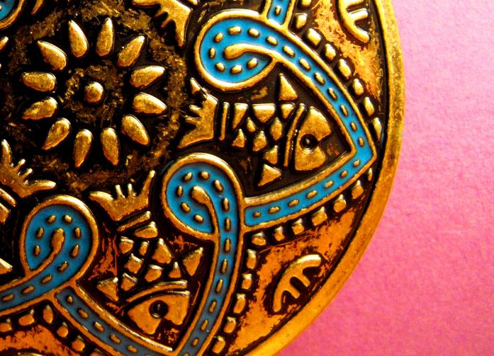 Taken for day 5 of project 365. (only 360 days to go!)
to celebrate this milestone (not) i've decided to go with a circle themed photo.
I've been playing with the super macro function on my camera and i've fallen completely in love with it. *gushes* This is a section of my favourite pair of earings (at the moment, my love for earings is VERY fickle) the earing measures 55mm (2.1") in diameter and the section in the photo is about 35mmx30mm (1.3"x1.1")
I took a number of these and it was so hard to pick the one to submit.
Enjoy.. Fijifilm FinePix S1000fd digital camera. Earing, 40w desk lamp, monopod.. In Object, Fashion accessories. Earring, photography by Leanne Schneller. Image #203465