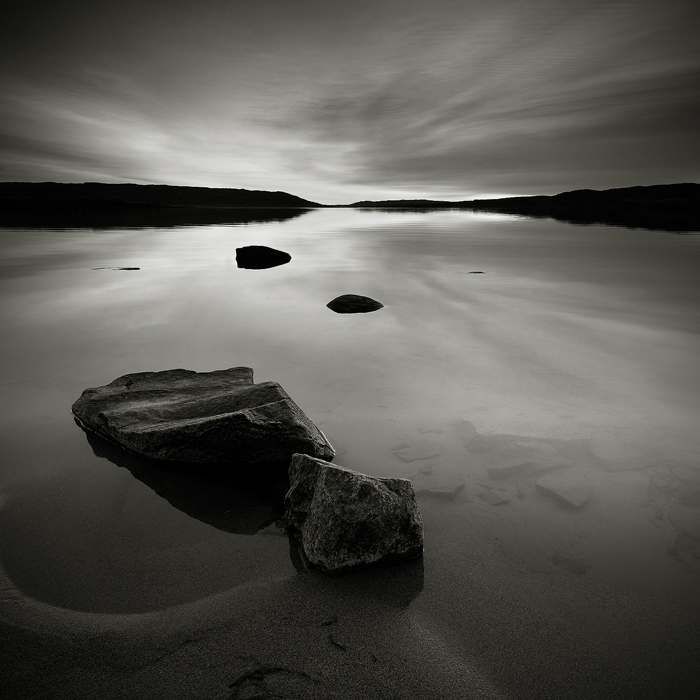Beach, Rocks and Water, photography by Anders Naesset. Sunset by the lake Tyrifjorden, eastern Norway.. Canon EOS 5D, Canon EF 17-40L, Cokin Z-Pro ND8 grad. Duotone. In Nature, Scenery, Waterscape