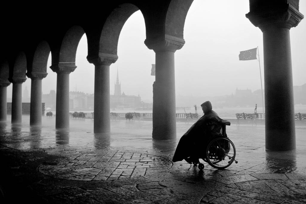 Waiting For The Rain To Stop, photography by Mikael Raymond. Heavy raining it was that day and luckily I wasn't the only one that managed to found some shelter.

Oldie but a goldie. Had this one before here at AL and that one was a version with sepia toning. I didn't like the sepia toning that much, so here we go with a b&w version instead.. Nikon d80 18-55. PS. In Construction, Street