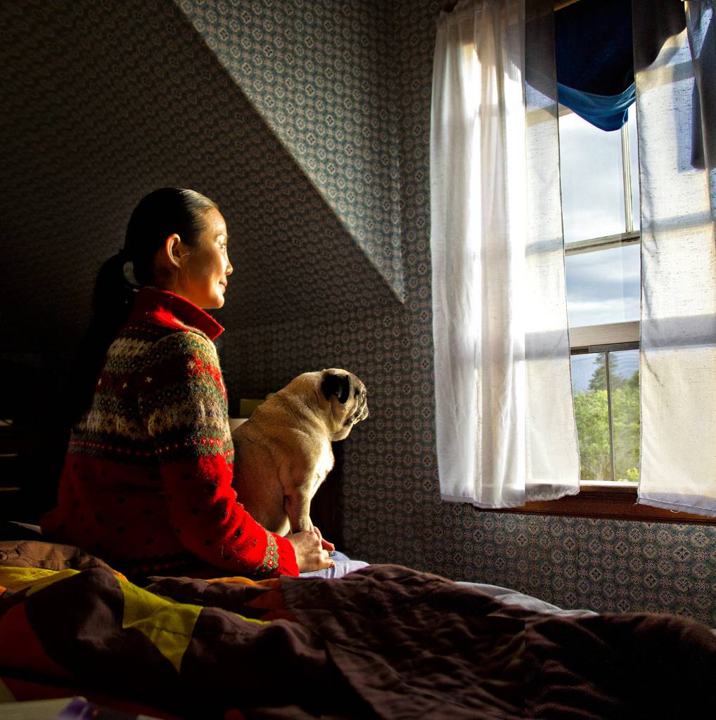 window light, photography by Jared Christopher Martin. Wife Yu Wei and pug Shou Pang (little fat) at a window in the upstairs bedroom of our house in Maine. I've used this setting so many times because of the miraculous quality of light - almost superstitiously believing the window is a portal to another world. The animation on Wei's face tells me she sees something out there; perhaps the source of this wonderful illumination. Shou Pang is more philosophic.. hassleblad. In People, Portrait
