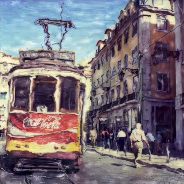 Tram N# 15, photography by Jose Goncalves. A project, now interrupted (maybe forever) since SX-70 are no longer available, Whit the trams in my hometown Lisboa.
Technic Used :
After the film came out, I waited until the first lines of the photo start to appear. Then with a tool with two size smooth steel balls at the ends, in a hard surface, i apply some soft pressure to smudge the contours of the object, usually with the bigger steel ball, made the white lines with the smaller ball, and continue to work,again with the bigger ball again and soft pressure to distort the rest, until I get the result want. I spend some time around this kind of work, like 10 minutes, more than that,it just depends. Most of the time, since the emulsion was soft and you are able to work in him,I kept dragging this part there and the other there, doing very small adjustments, there is no undo. There are no edition with Photoshop, apart the scanning and adjusting colour and contrast, this was made to the film after ejection from the Polaroid SX-70 camera.. Polaroid SX-70, camera and film. Emultion Manipulation. In Construction, Street