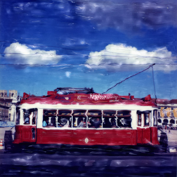 Red and Blue, photography by Jose Goncalves. A project, now interrupted (maybe forever) since SX-70 are no longer available, Whit the trams in my hometown Lisboa.
Technic used :
After the film cames out, i waited until the first lines of the photo start to appear. Then with a tool with two size smooth steel balls at the ends, in a hard surface, i apply some soft pressure to smudge the contours of the object, usually with the bigger steel ball, made the white lines with the smaller ball, and continue to work,again with the bigger ball again and soft pressure to distort the rest, until i get the result want.
 I spend some time around this kind of work, like 10 minutes, more than that,it just depends. Most of the time, since the emulsion was soft and you are able to work in him,I kept dragging this part there and the other there, doing very small adjustments, there is no undo. There are no edition with Photoshop, apart the scanning and adjusting colour and contrast, this was made to the film after ejection from the Polaroid SX-70 camera.. SX-70. SX-70 Manipulation. In People, Everyday, City life