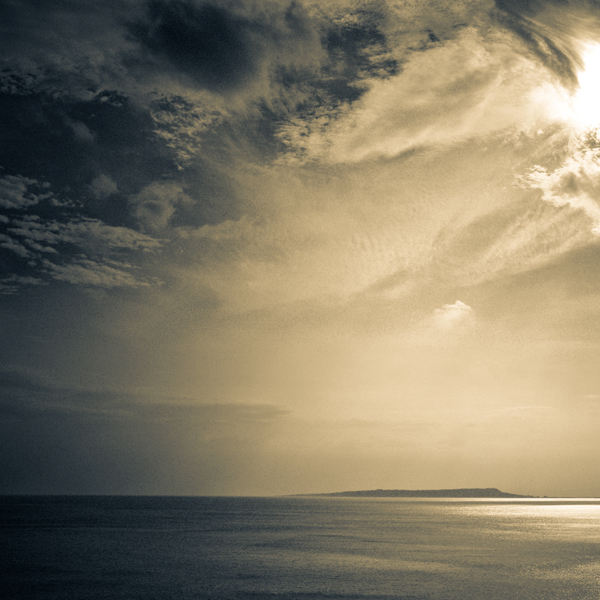 The Distant Shoreline, photography by Omar Nakib. Standing on the edge...A view of the Weymouth peninsula from Lulworth Cove, Jurassic Coast, England.. Canon 5D, 24-70mm f/2.8L @ 34mm. In Nature, Scenery, Waterscape