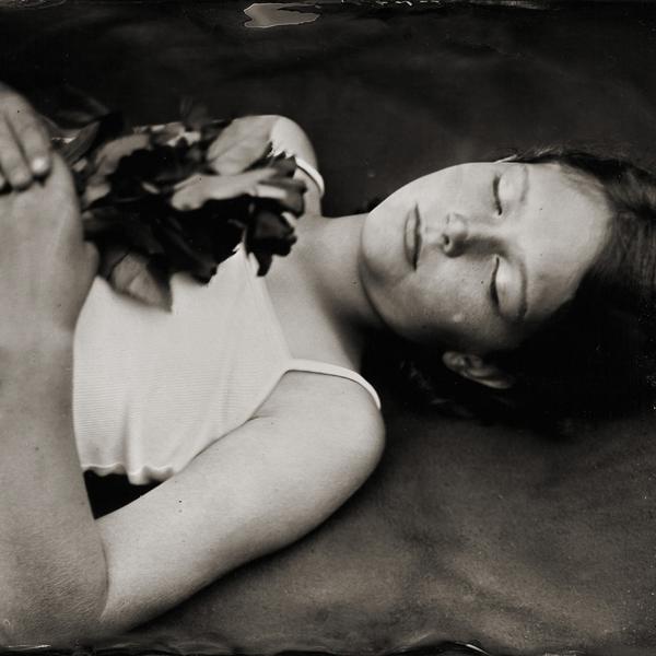 The Girl With The Rose, photography by Deborah Parkin. A portrait from my latest project "Stillness in Time" .. wet plate portraits of childhood.  All these portraits have been a collaboration between me the photographer and the children who decide how they would like to be photographed.  The wet plate process has a very slow exposure time .. this was 5 seconds, each child lays very still and seems to drift off into their world momentarily.. Toyo 45 field camera. wet plate collodion. In People, Infant, children, Girl