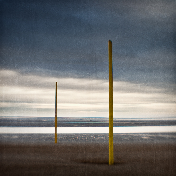 I have no idea what purpose these yellow posts (which are as tall as telegraph poles) served.. Single Element Lens. In Nature, Scenery, Waterscape. Poles Apart, photography by Mark Sadlier. Image #224285