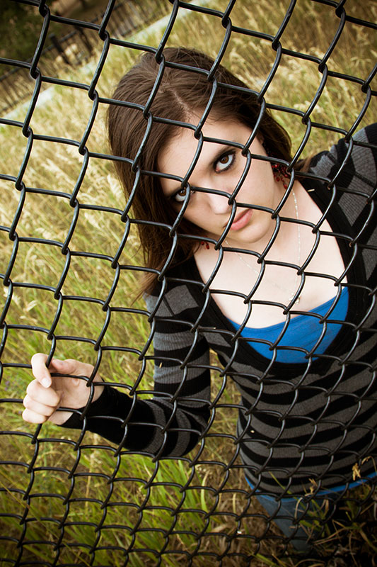 Through a Fence, photography by Jordan Ewert. Canon 20D. hand held. In People