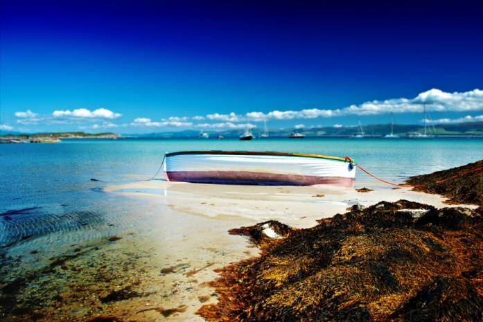 White Boat, Gigha Island, photography by Alan Gilholm. This boat fascinated me, its colours bleached by then sun, it looked as though it was basking in the light of the day.. Canon 400D. In Nature, Scenery, Waterspace