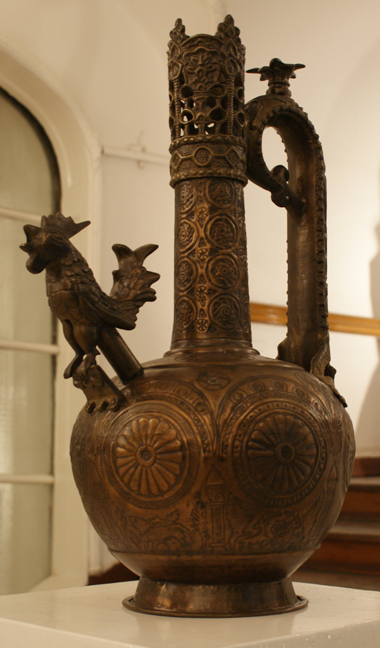 Wonderfull Marawan Ebn Mohamed Vessel !!! Handmade, sculpture by Karam Haydy. Mohamed Rizk. 
Many of his works placed in Egyptian and International Museums, in addition to art collectors all over the world. He was attracted to metals and fascinated and even captivated by copper, his works either hammered copper, steel or both combined. Rizk differs from most artists, in that he refuses to conform to one stable and repetitive style, his artistic development encompasses numerous technical abilities. His refusal to be cast in one known style or mode is a result of his great self honesty and penetration into a life that refuses to set itself in a solid cast .Thereby the variety and richness of his techniques as represented by the different points of viewing the same reality. In spite of the variance in techniques as represented by the different phases of Rizks artistic development, his vision is steadfast and centers around mankind, mankind is represented through heroic poetry, bravery, stalwartness, sadness, resistance, depth, happiness and beauty. 
M. Rizk
Biography
Mohamed Rizk, Egyptian Sculptor.
1937 Born in a village near Damietta 
1959 Worked at the Egyptian Iron & Steel factory, where       he discovered the medium of Copper that held his          attention to the present day. Self taught following only his inborn talent and learning from the copper craftsman that is still present in modern day Egypt
1962 awarded the encouragement prize (Ministry of     Culture), thereafter closely followed by the media in Egypt
1964 First one man show exhibit at wekalet El Ghouri
1965 Awarded the Nations Grant for the Arts until 1975. 
1967 Participated in the Egyptian Contemporary Art Exhibit in Paris and Brussels.
1968 Participated in the United Arab League Exhibition for the human rights, Beirut.
1969 Second one man show Exhibit at Goethe Institute, Cairo, Egypt. Commissioned to do 90 works for the Sheraton Hotel of Cairo.
1970 Designed and erected a monumental brass work (25 sq. meters) for the entrance of the Ahram newspaper building.
1971 Commissioned by the Egyptian Army to design and execute the National emblems on army buildings.
1972 Trip to Europe to study its museums. Finished three large works for the Meridian Hotel in Cairo.
1973 Finished a major work for the entrance of the Ministry of Military Production.
1976 Involved with the execution and magnification of Marwan Ebn Mohamed Kettle (a major Islamic Relic).
1979 Major exhibit at the National Hall of fine Arts.
1980 Executed his large copper horse.
1982 Finished a large work for the entrance of the Nile Hilton Hotel in Cairo.
1983 The Ministry of Culture Published a documentary of his life and art work.
1984 Completed another major work for El Nasr Auto manufacturing building.
1985 Completed major works for public places. 
1986 Major exhibit at Ikhnaton Gallery.
1987 Sculpture for the Export Bank of Cairo.
1988 Exhibited as a representative of modern Egyptian art accompanying the exhibition of Ramses the second at the Denver Museum of National History, held a series of exhibitions in five American states.
1989 &ndash;1990 Completed major work for Nile Romance Hotel in Cairo.
1992-1993 Completed three works for the Marriot Hotel in Sharm El Sheikh, Ahram newspaper building, and sofotel hotel in Hurgada.
1995-1996 Completed a major work at the Western Egyptian Gates.
1997-1998 Completed his huge village girl at city square in Sharm El Sheikh.
1999 Completed his famous feminine violin and the seated Troubadour (Rababa Player) in the Egyptian Opera house garden.
2000 Finished two major wall pieces for the Military Pilots College, and Almaza Military airport hall.
2001 Completed the birds of freedom in the Youth Center for Creation in the Opera House, Cairo.
2002 Finished his six Horses for Dubai Airport.
2005-2006 Completed his major wall piece (Havilland plane), and the village girl in Terminal three at Cairo Airport.
2008 Passed away.
  If you have any question please email us at (karam3499@yahoo.com 
. Manual Tools special for hammered copper. Handmade from hammered Copper