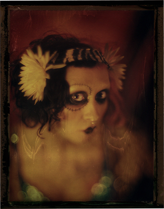 Lana is a creative juggernaut: a musician, clothes designer, jewelry designer, doll maker, makeup artist, hair stylist, photographer, belly dancer, you-name-it she can do it. Real tattoo.
http://www.crudethings.com/

Hair,makeup and styling by Lana Guerra. Graflex Speed Graphic, Aero Ektar 178 mm 2.5 lens. Negative from Fuji FP-100C45 instant film. In People, Portrait, Female. Lana 2, photography by James Wigger. Image #387222
