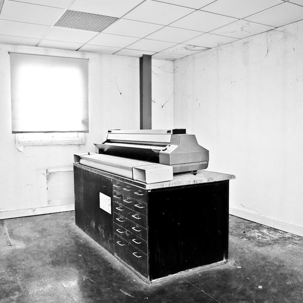 tireuse de plans, photography by Pierre-olivier Mazoyer. unused drawings printer in a factory which is about to close. canon 5D mk2 + 24-70L F2.8. transfered in b&w with lightroom. In Industrial, technology, Machine