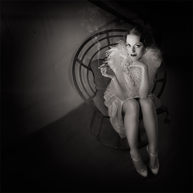 Wicker Chair - Fauteuil D'Osier, photography by Audrey Krommenacker. S&eacute;ance de pose improvis&eacute;e dans le froid du grenier, au p&acirc;le &eacute;clairage &agrave; la bougie.
Mod&egrave;le : Lily Deslys (www.lilydeslys.com)

Posing-session improved in the attic's cold, the only light comes from a candle.
Model : Lily Deslys (www.lilydeslys.com). Nikon D90s. In People, Character, Pin-up