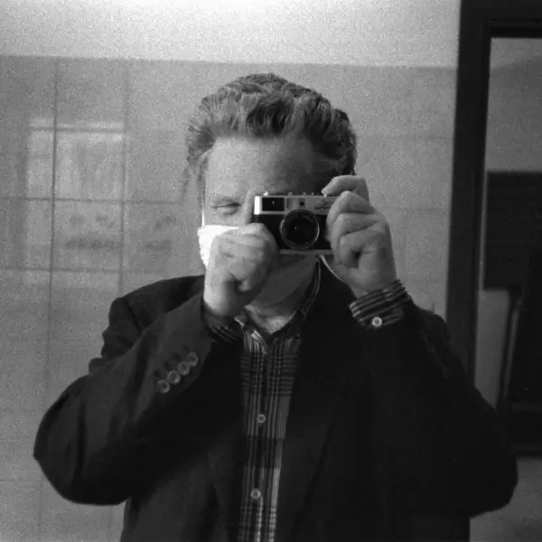 Self-portrait with face mask by Johannes Beilharz