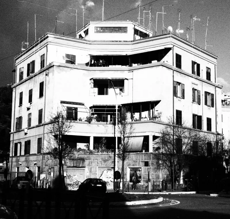 Palazzo in Garbatella is a creation by the artist Johannes Beilharz. Category art work. Garbatella is a working class suburb of Rome. Olympus OM-D E-M10. Black and white retro manipulation. 1 distinction, 3K views, 7 appreciations.