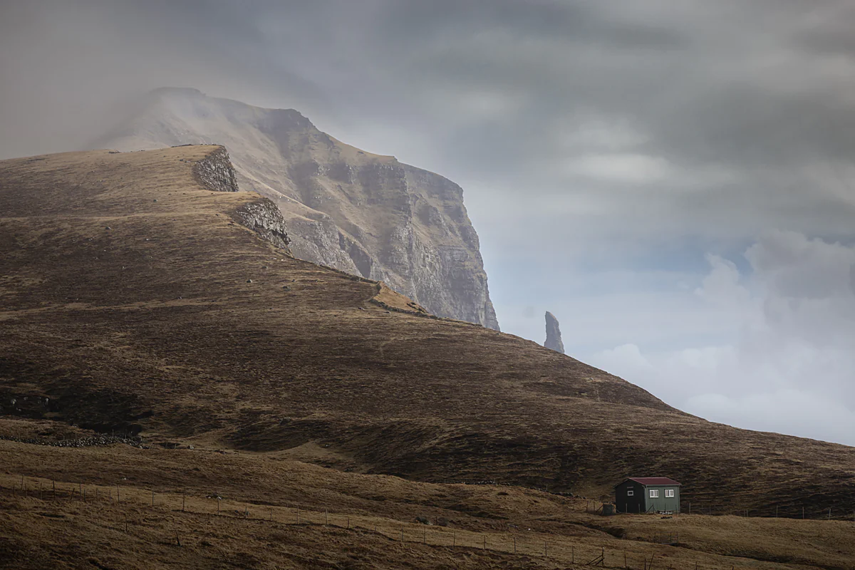 The Light Of Day VI is a creation by the artist Frank Hoogeboom. Category Nature, Landscape, Mountain, Fine-Art, Contemplation, Naturalism, Photography, Digital. Glimpse of the Witches Finger on the island of Vágar, Faroe Islands. Canon EOS 6D with Canon EF24-105…